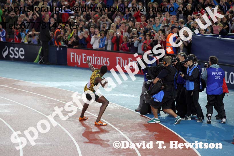 Usain Bold playes to the photographers and the crowd after bring  Jamaica to victory in the 4 x 100 metres at the Commonwealth Games, Glasgow. Photo: David T. Hewitson/Sports for All Pics